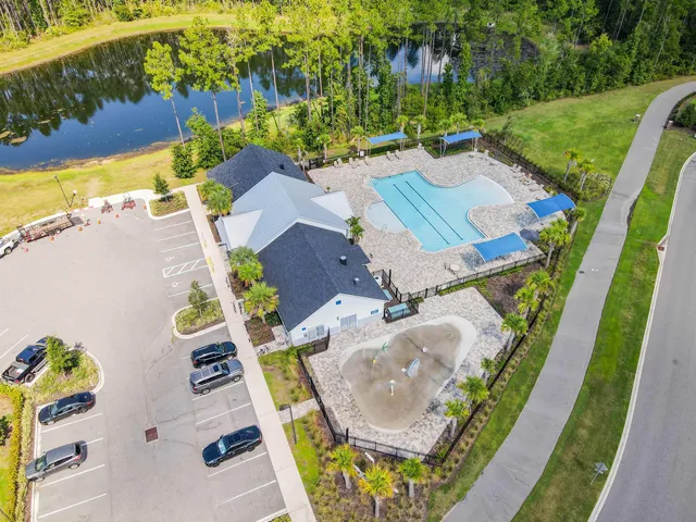 a view of a swimming pool with a lounge chair