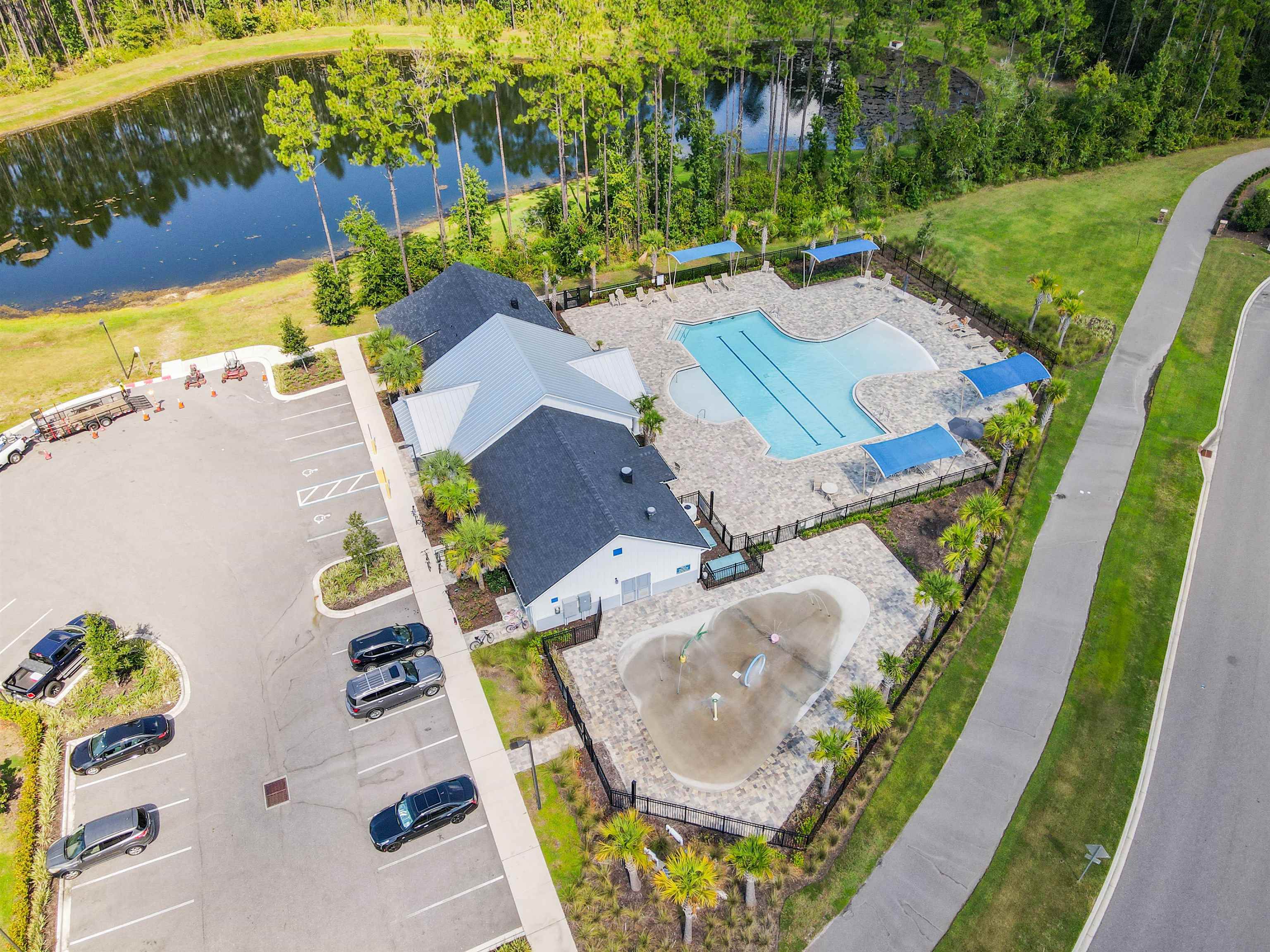 297 Coastline Way Street St. Augustine, FL 32092 - Photo 32 of 36 an aerial view of a house with garden space and swimming pool