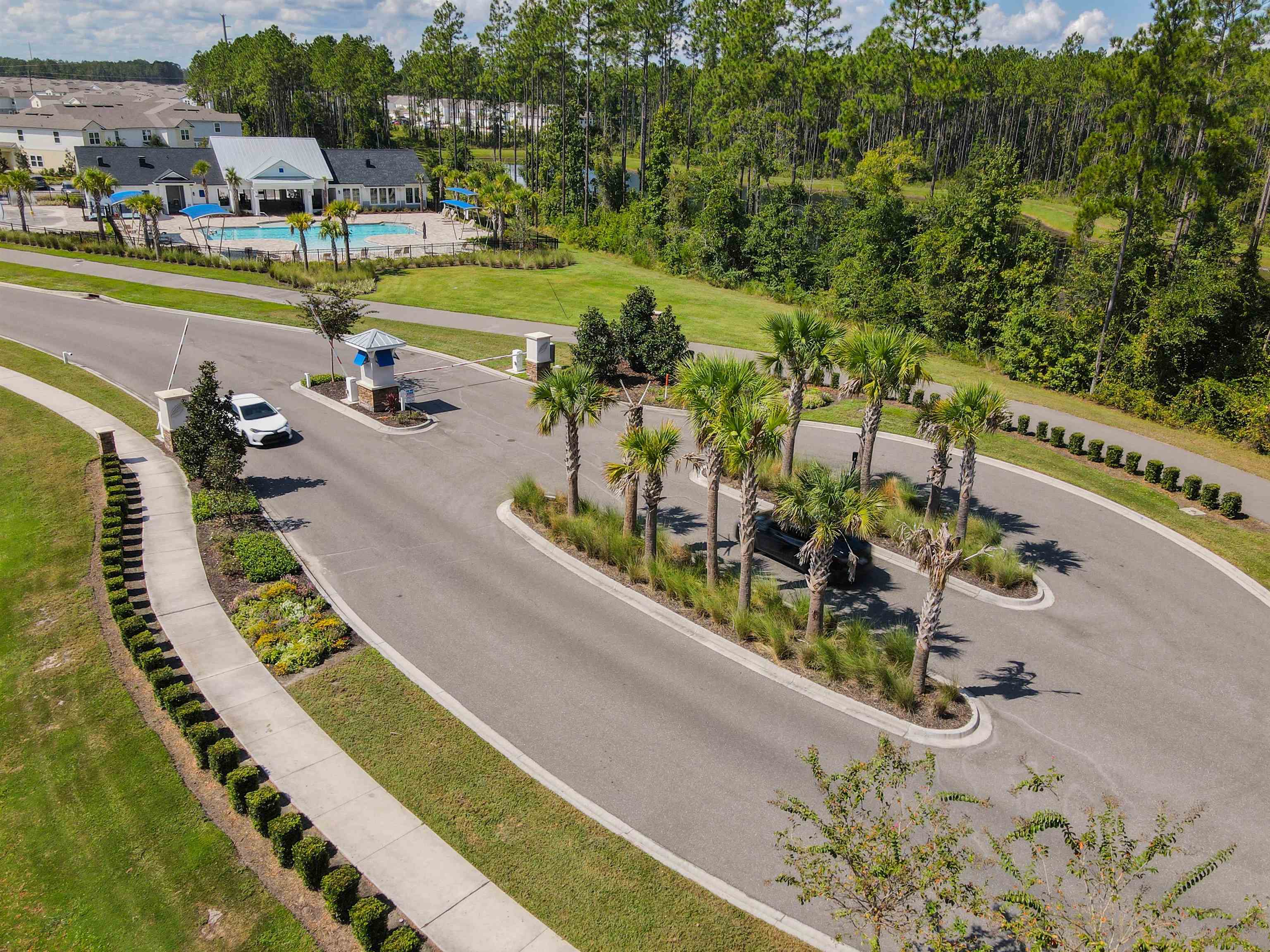 297 Coastline Way Street St. Augustine, FL 32092 - Photo 34 of 36 an aerial view of a swimming pool with lawn chairs and plants