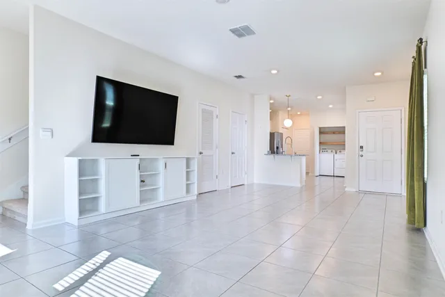 wooden floor to ceiling window and flat screen tv