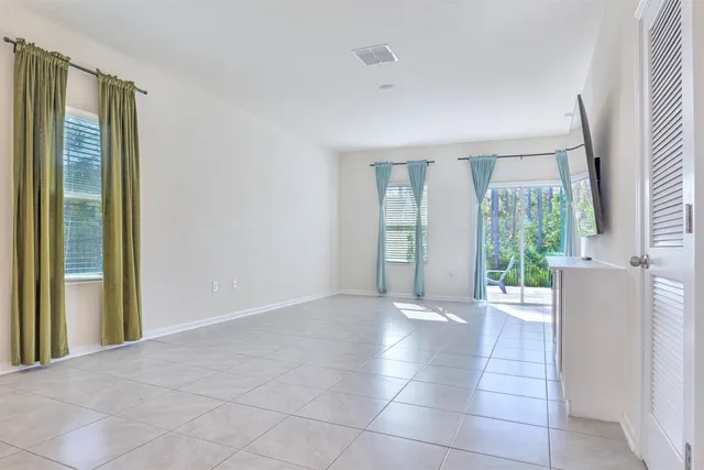 a living room with a flat screen tv