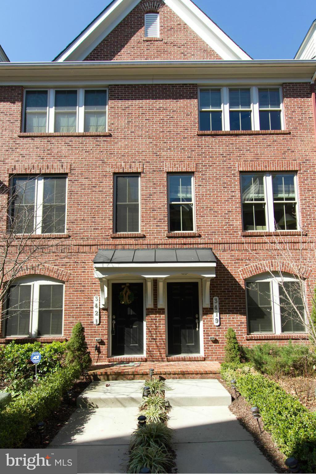3419 Kemper Road Arlington, VA 22206 - Photo 1 of 30 a front view of a house with plants and garage