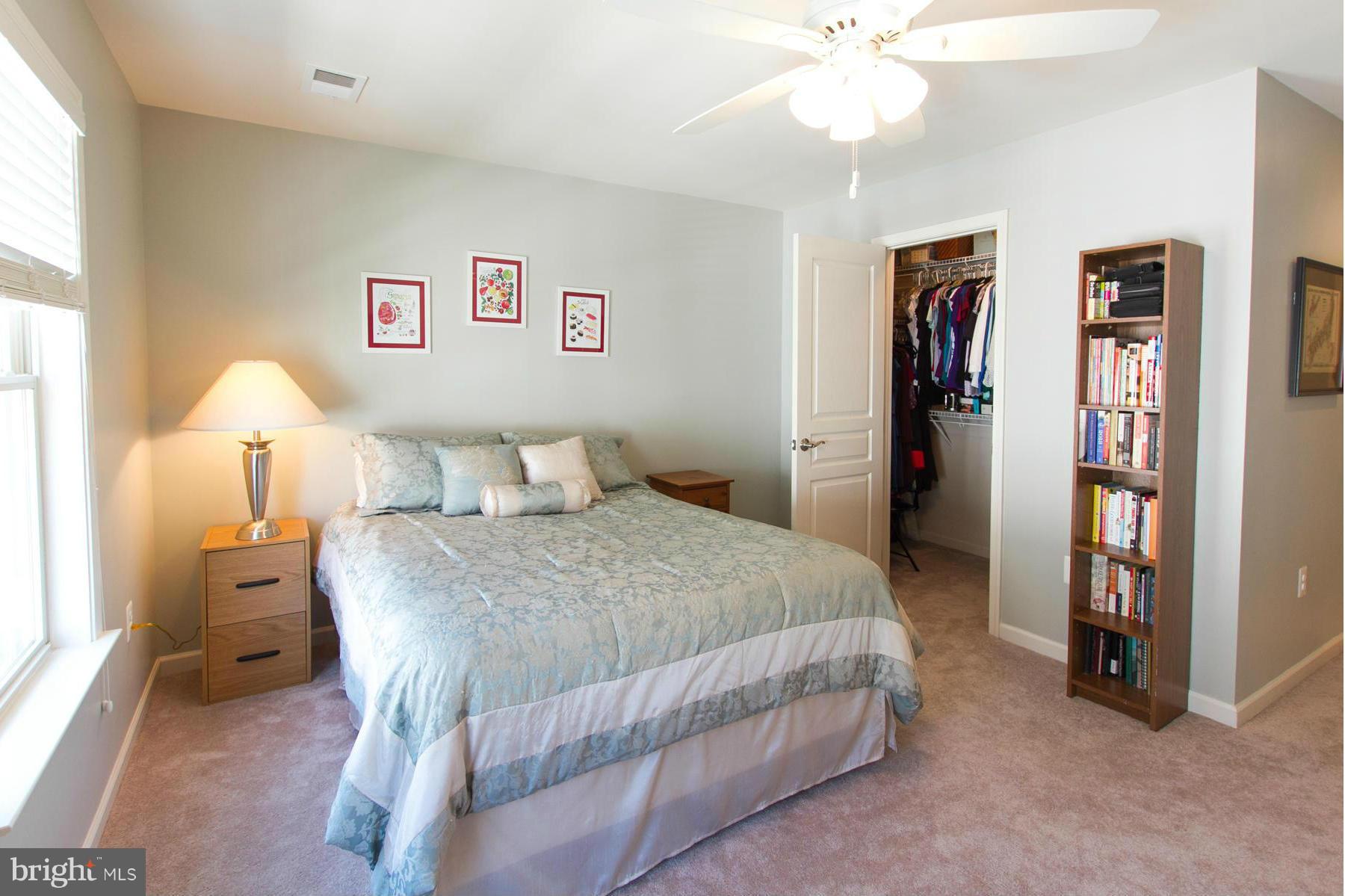 3419 Kemper Road Arlington, VA 22206 - Photo 13 of 30 a bedroom with a bed and a chandelier