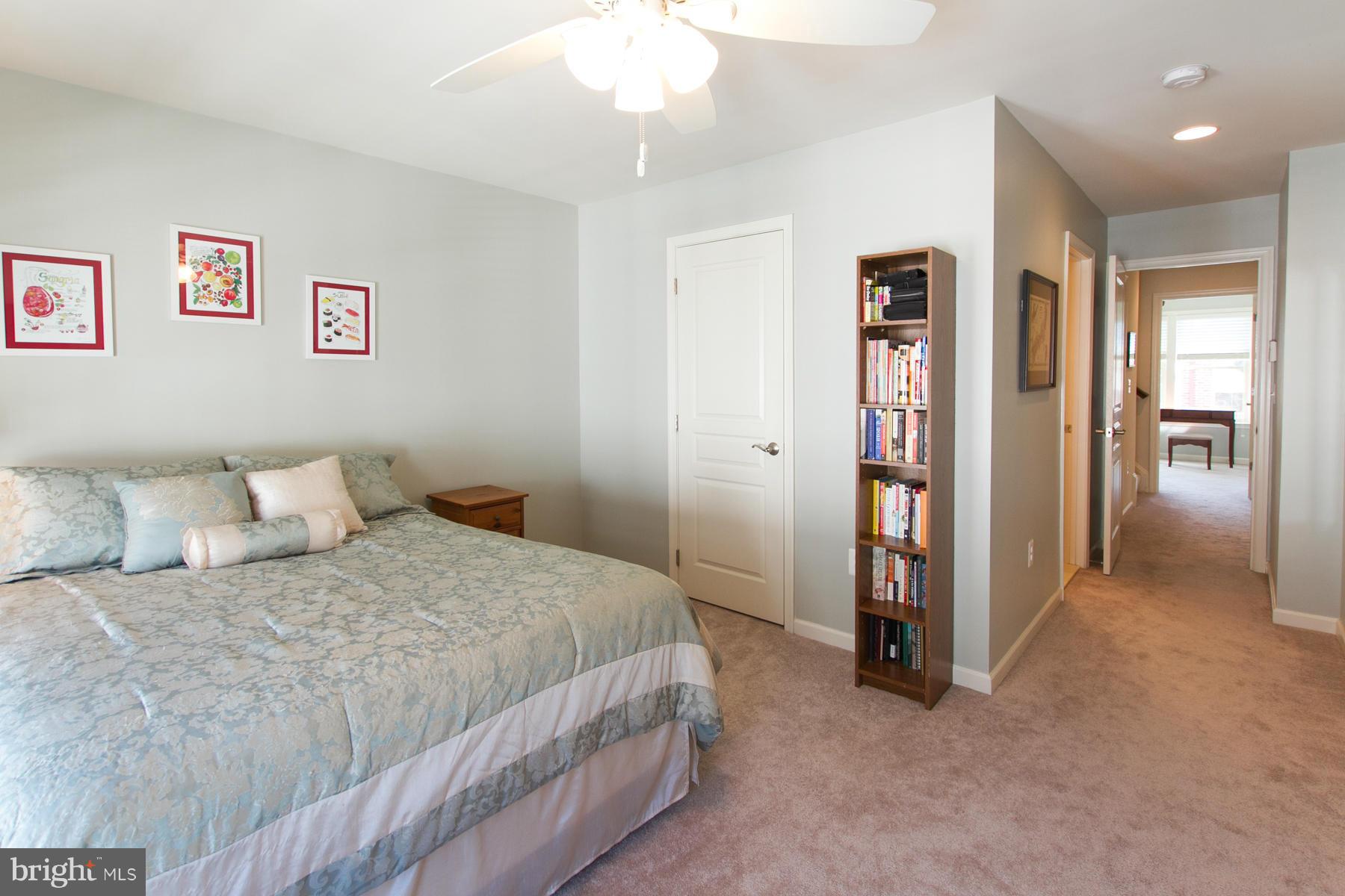 3419 Kemper Road Arlington, VA 22206 - Photo 14 of 30 a bedroom with a bed and a chandelier