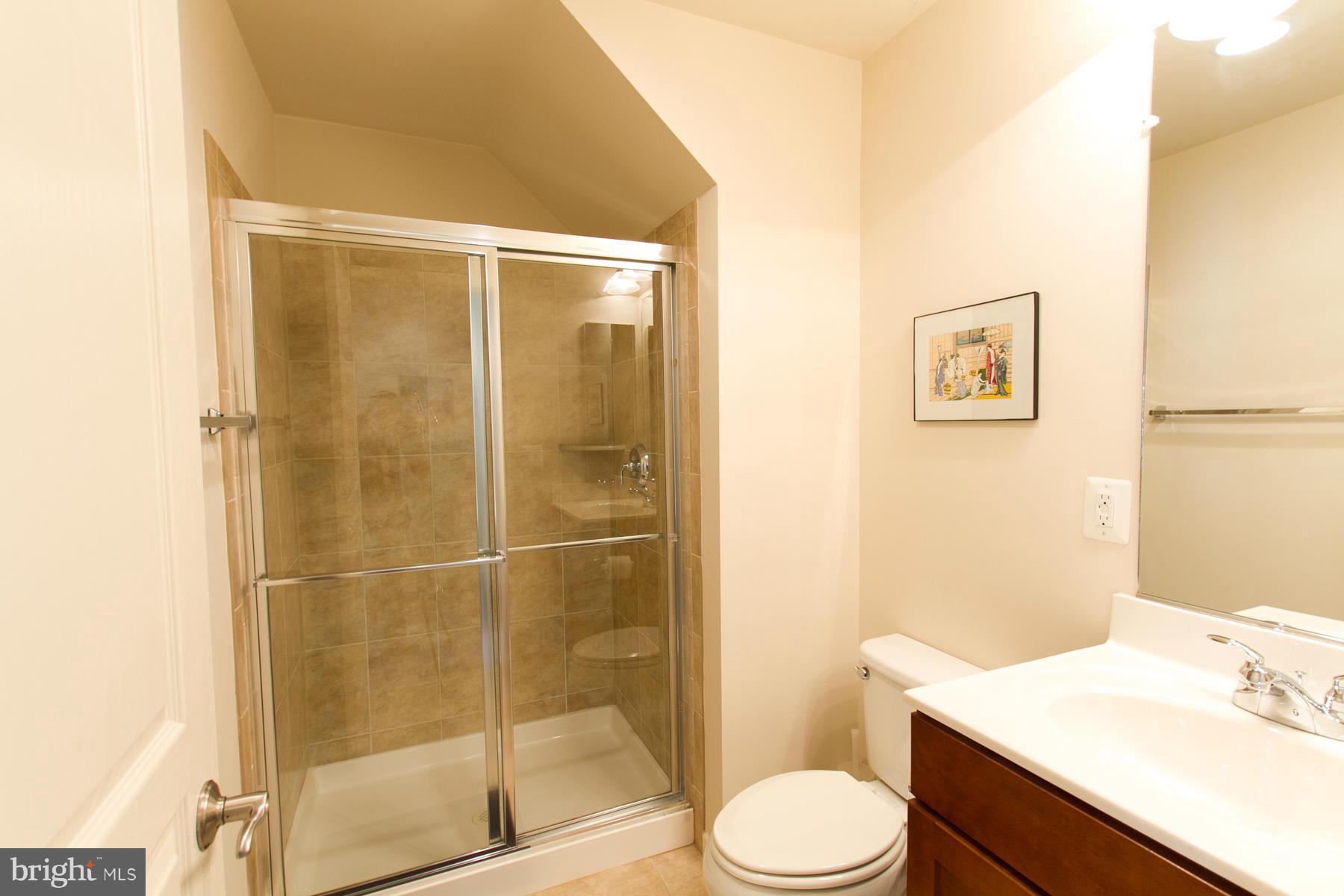 3419 Kemper Road Arlington, VA 22206 - Photo 15 of 30 a bathroom with a sink toilet and shower