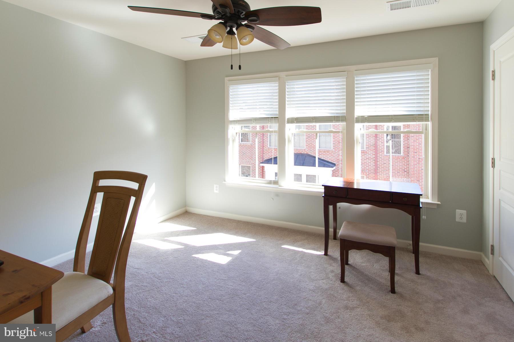 3419 Kemper Road Arlington, VA 22206 - Photo 17 of 30 a view of a workspace with furniture and a window
