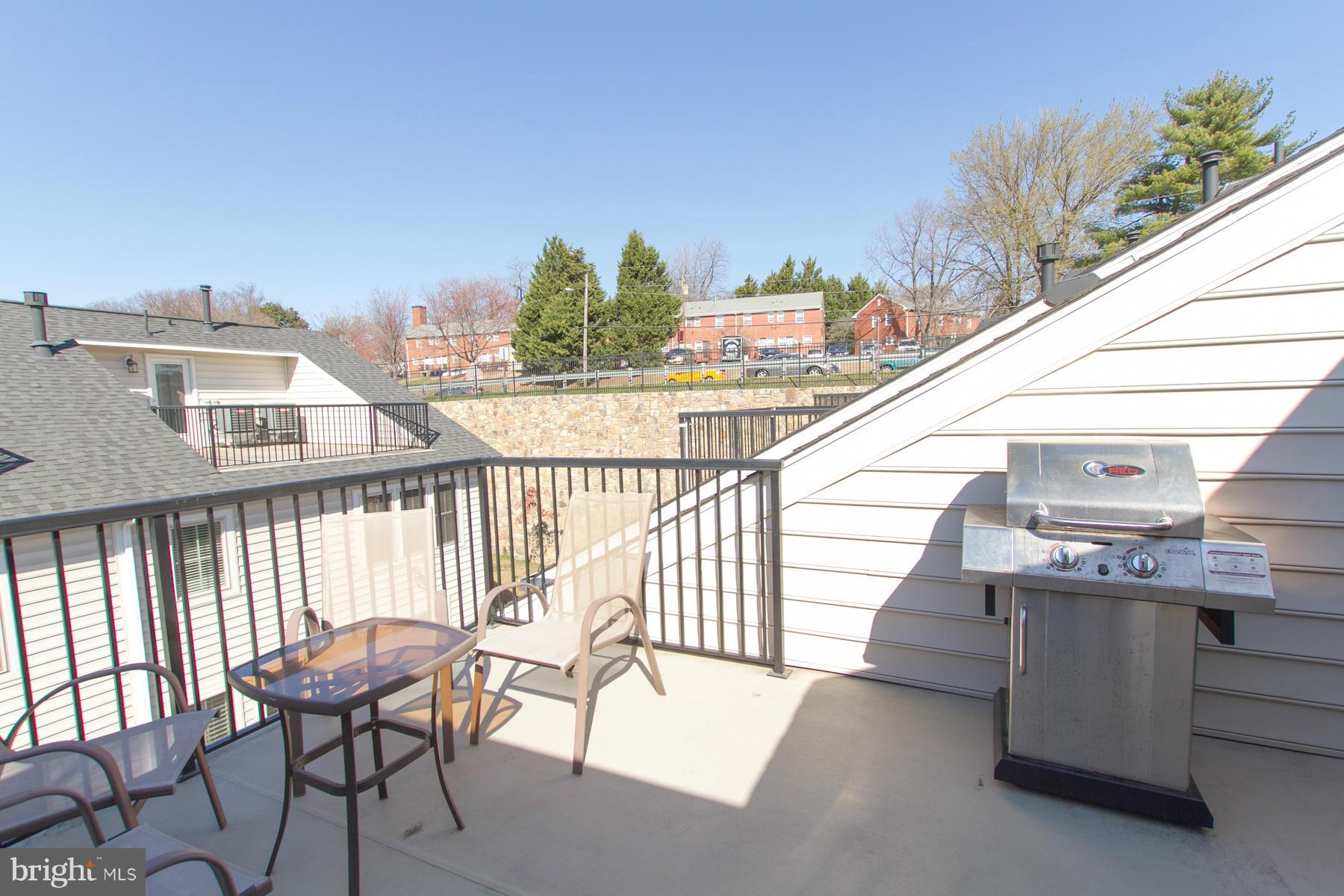 3419 Kemper Road Arlington, VA 22206 - Photo 20 of 30 a view of a chair and tables in the balcony