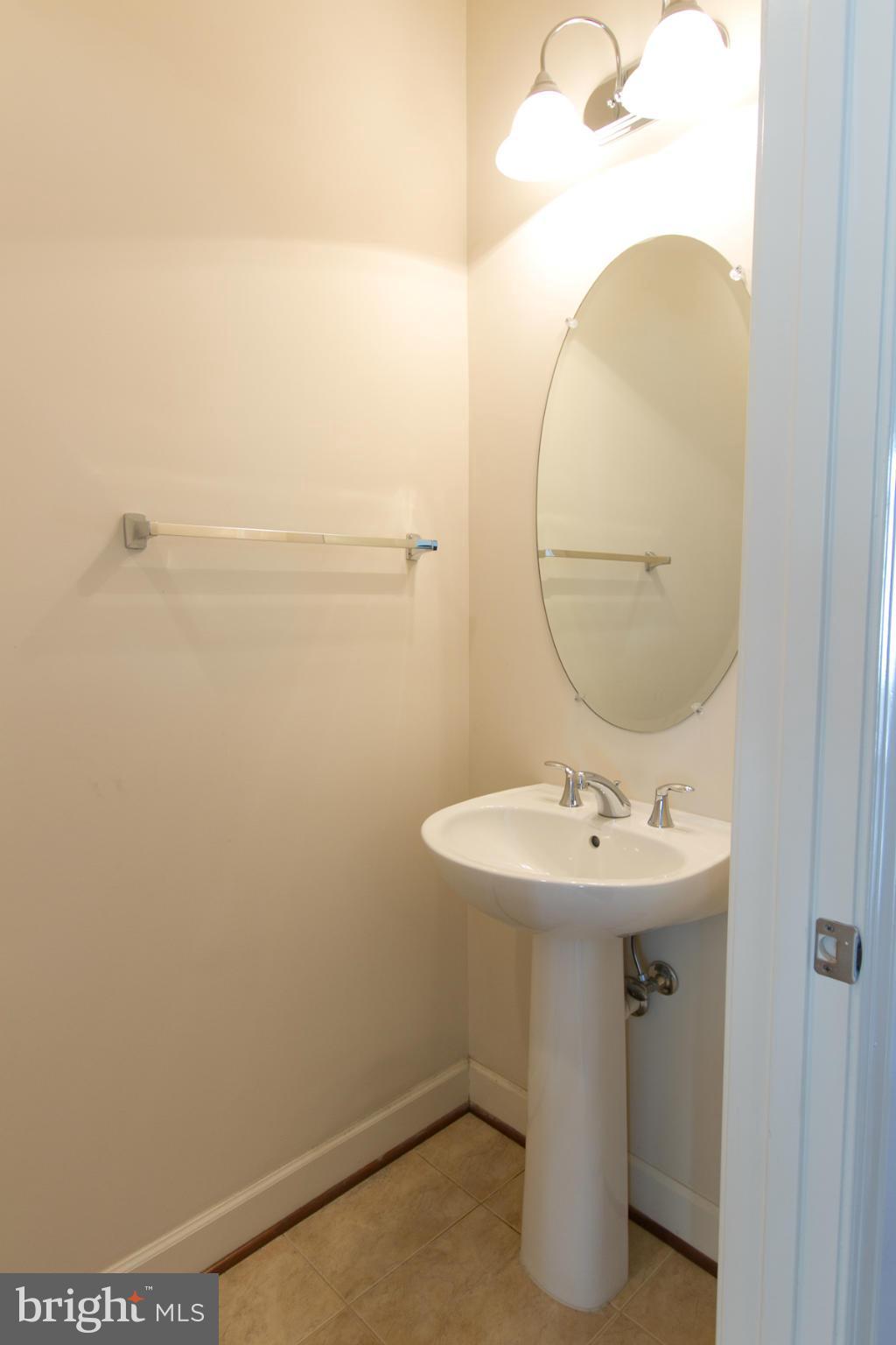 3419 Kemper Road Arlington, VA 22206 - Photo 24 of 30 a bathroom with a sink and mirror
