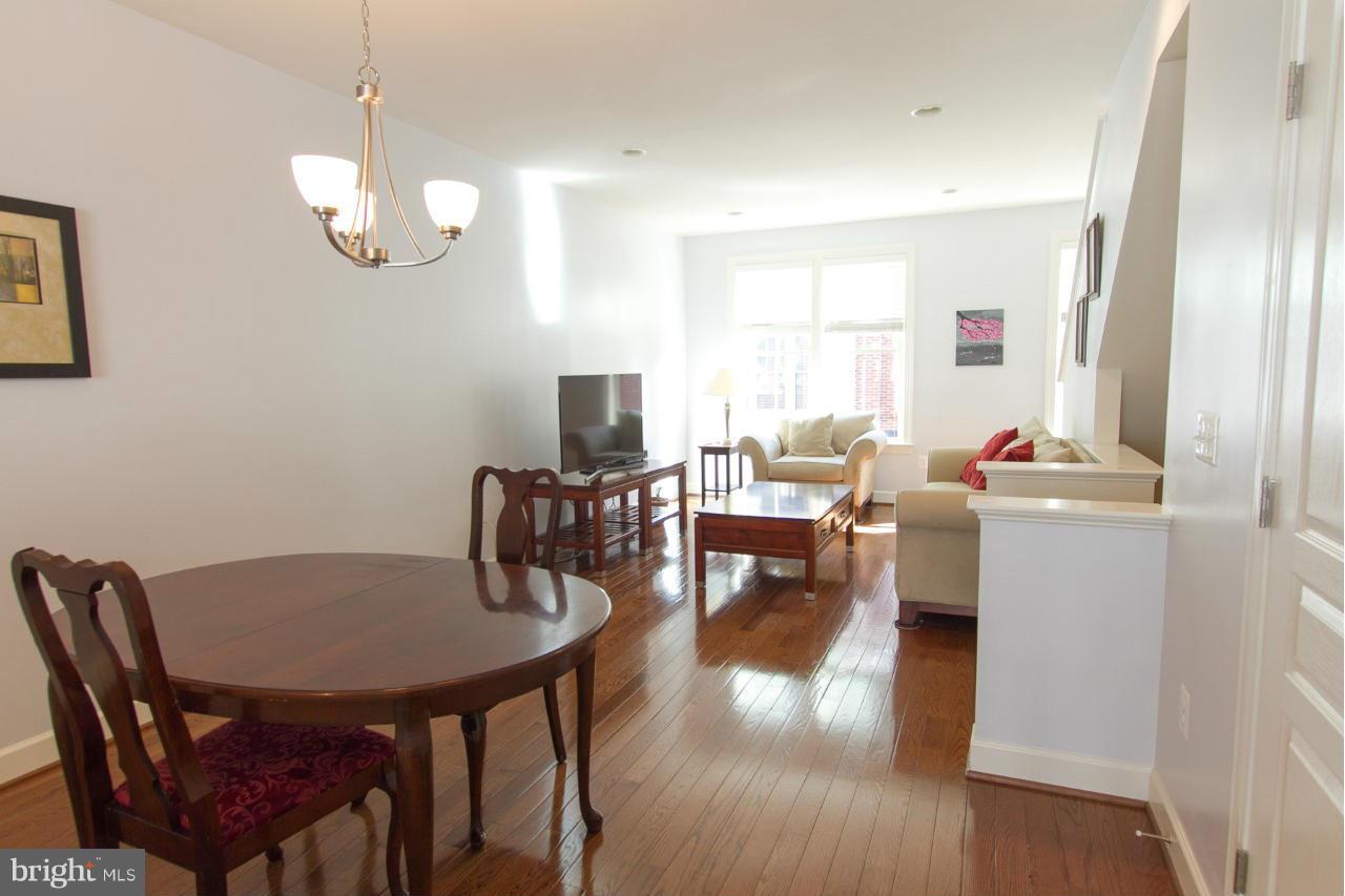 3419 Kemper Road Arlington, VA 22206 - Photo 5 of 30 a view of a dining room with furniture window and wooden floor