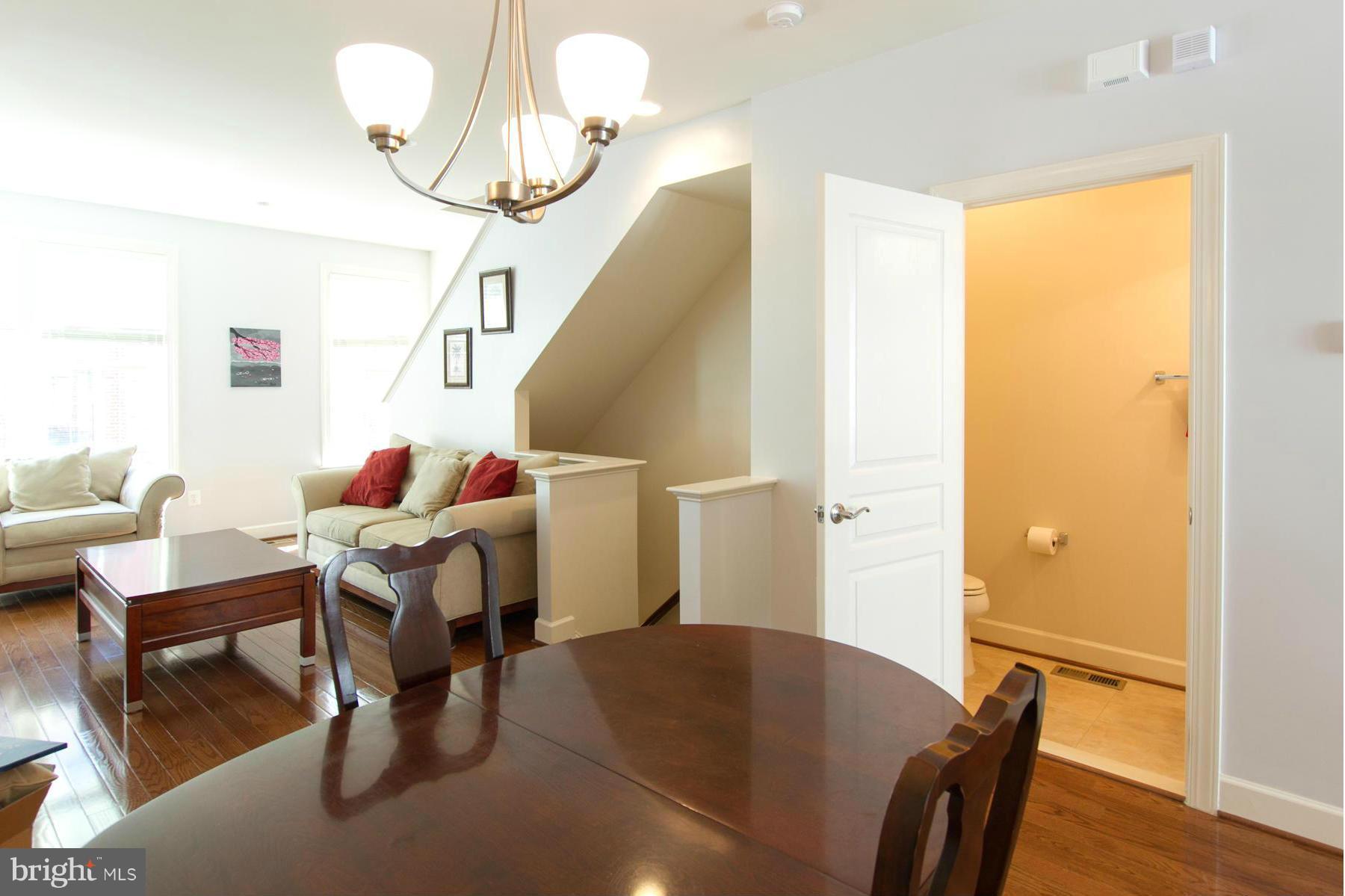 3419 Kemper Road Arlington, VA 22206 - Photo 6 of 30 a view of a dining room with furniture and wooden floor