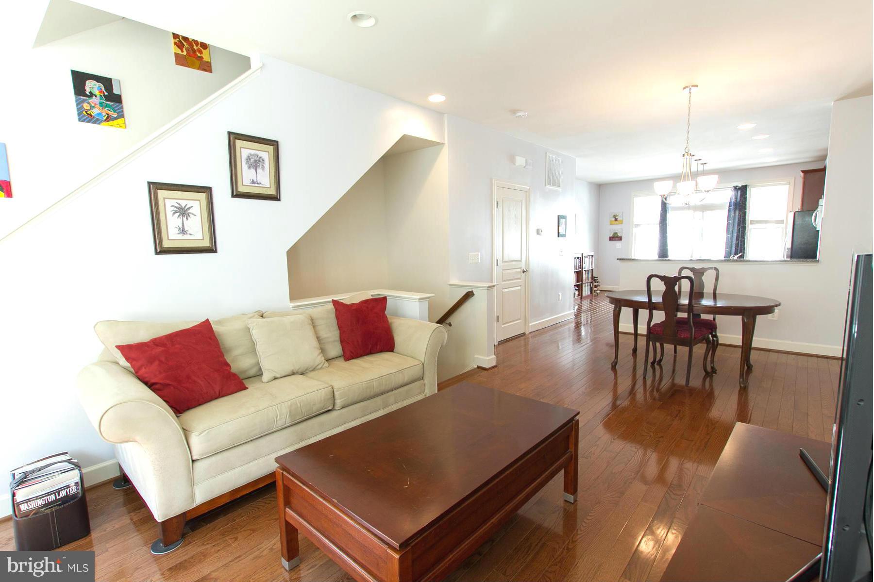 3419 Kemper Road Arlington, VA 22206 - Photo 9 of 30 a living room with furniture wooden floor and kitchen view