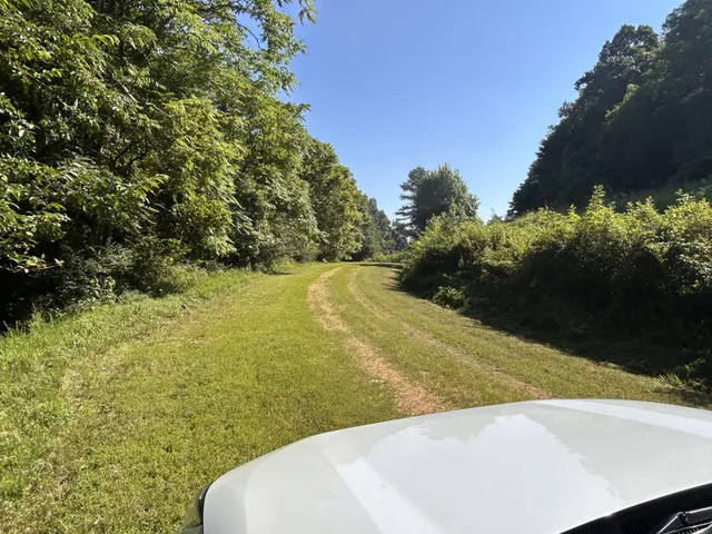 a view of a swimming pool with an outdoor space and seating area
