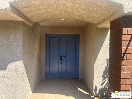 a view of a big room with windows