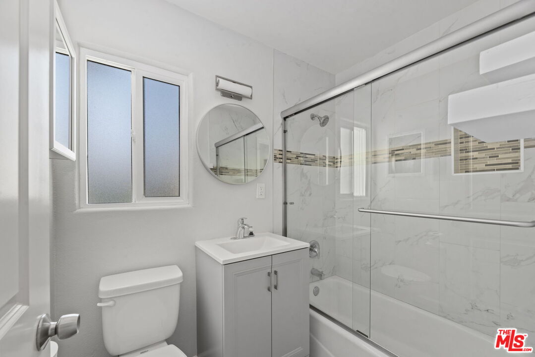 1960 North Ontario Street Burbank, CA 91505 - Photo 12 of 16 a bathroom with a toilet sink and shower