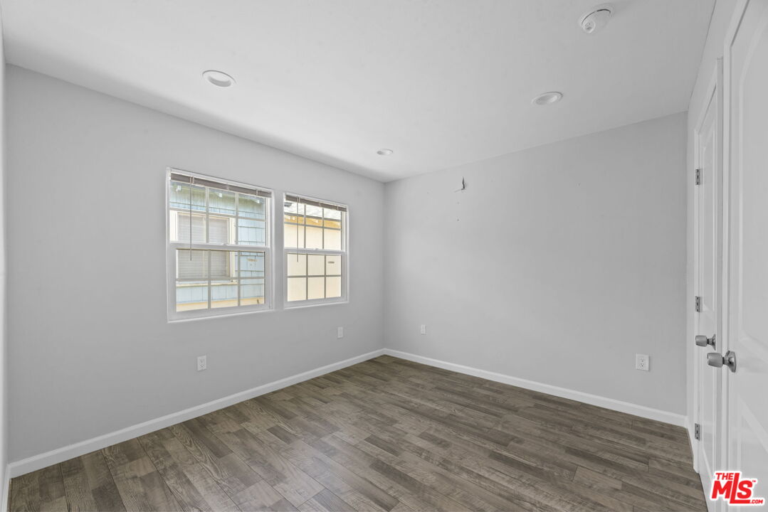 1960 North Ontario Street Burbank, CA 91505 - Photo 13 of 16 an empty room with wooden floor and windows