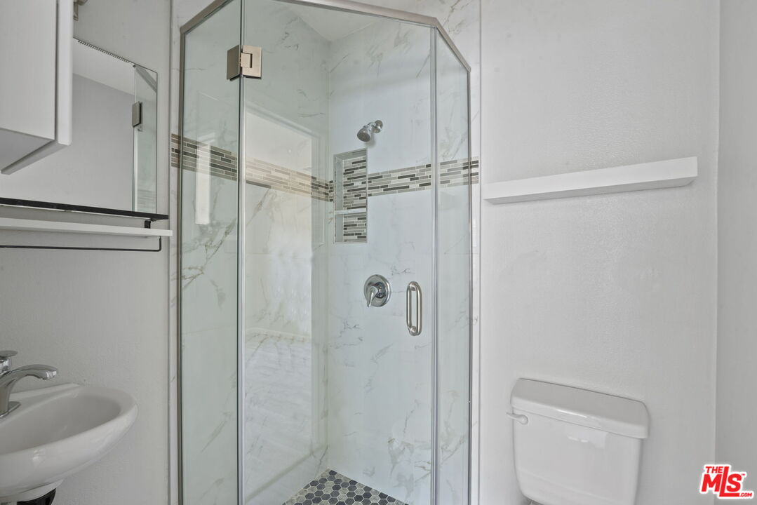 1960 North Ontario Street Burbank, CA 91505 - Photo 15 of 16 a bathroom with a shower and a sink