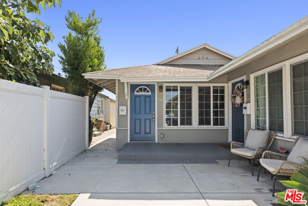 1960 North Ontario Street Burbank, CA 91505 - Photo 2 of 16 a view of a porch with a table and chairs and potted plants