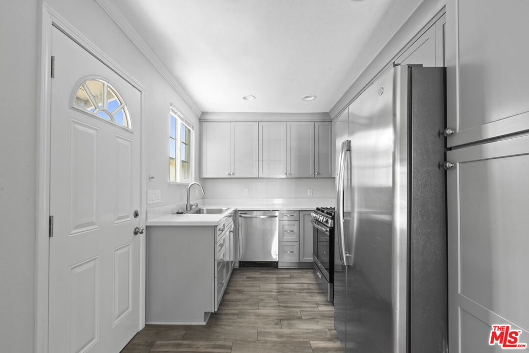 1960 North Ontario Street Burbank, CA 91505 - Photo 7 of 16 a kitchen with a sink stainless steel appliances and cabinets