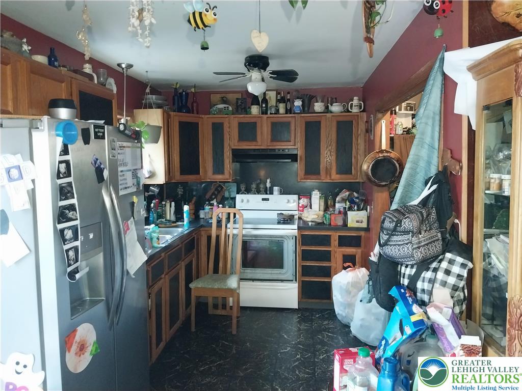 2108 Fox Road Bushkill, PA 18324 - Photo 15 of 98 a kitchen area with fireplace and outdoor seating