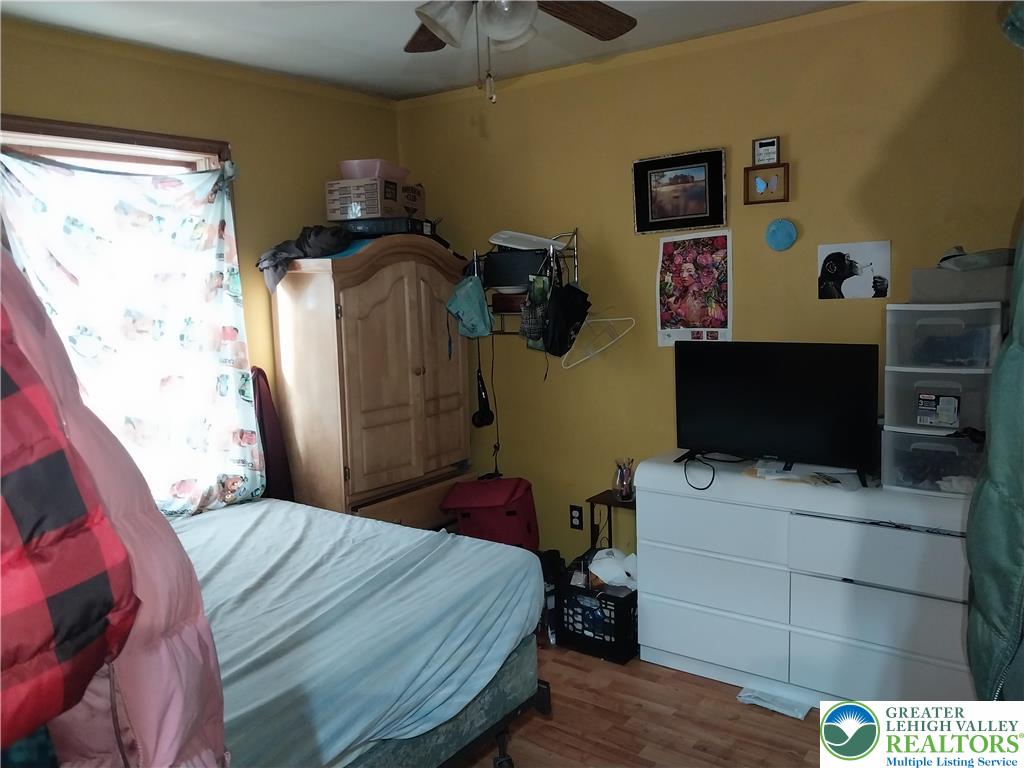 2108 Fox Road Bushkill, PA 18324 - Photo 34 of 98 a bedroom with a bed and flat screen tv