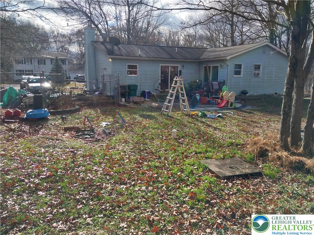 2108 Fox Road Bushkill, PA 18324 - Photo 93 of 98 a view of a chair and table in backyard