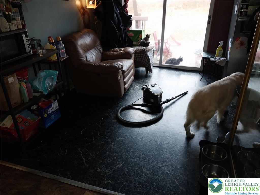 2108 Fox Road Bushkill, PA 18324 - Photo 10 of 98 a living room with furniture and a floor to ceiling window