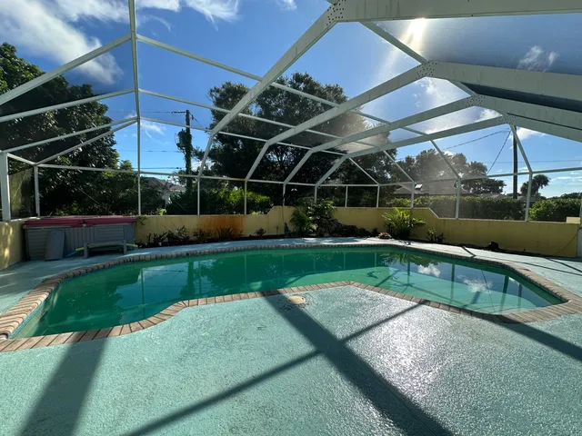 a view of a backyard with sitting area