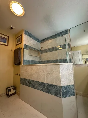 a bathroom with a tub and a shower