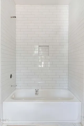 a kitchen with counter top space sink and window