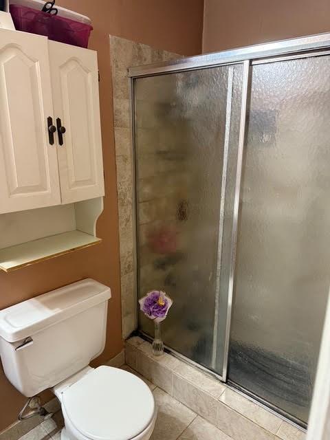 6495 Revena Drive Morrow, GA 30260 - Photo 11 of 14 a white toilet sitting next to a bathroom sink