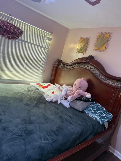 6495 Revena Drive Morrow, GA 30260 - Photo 13 of 14 a bedroom with a bed and dresser