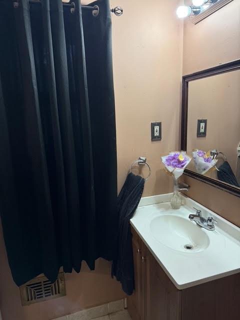 6495 Revena Drive Morrow, GA 30260 - Photo 10 of 14 a bathroom with a sink vanity and a mirror