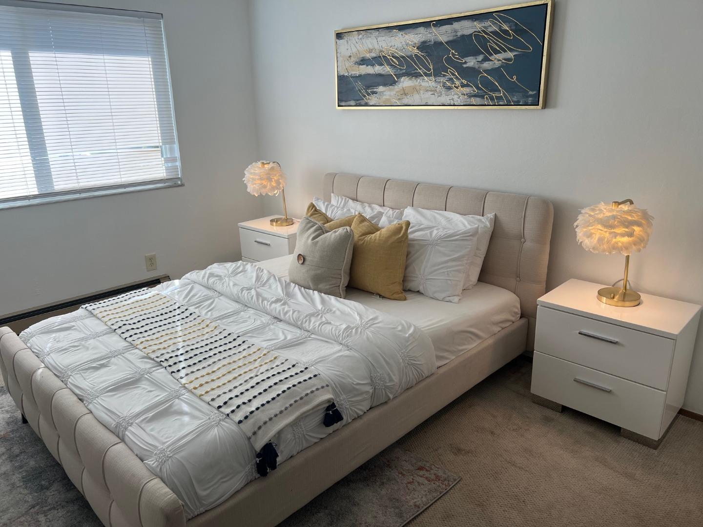 1119 Reed Avenue, Unit C Sunnyvale, CA 94086 - Photo 13 of 20 a bedroom with a bed and window