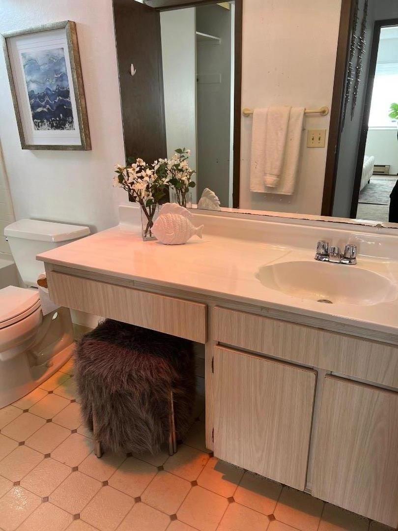 1119 Reed Avenue, Unit C Sunnyvale, CA 94086 - Photo 14 of 20 a bathroom with a sink and a mirror