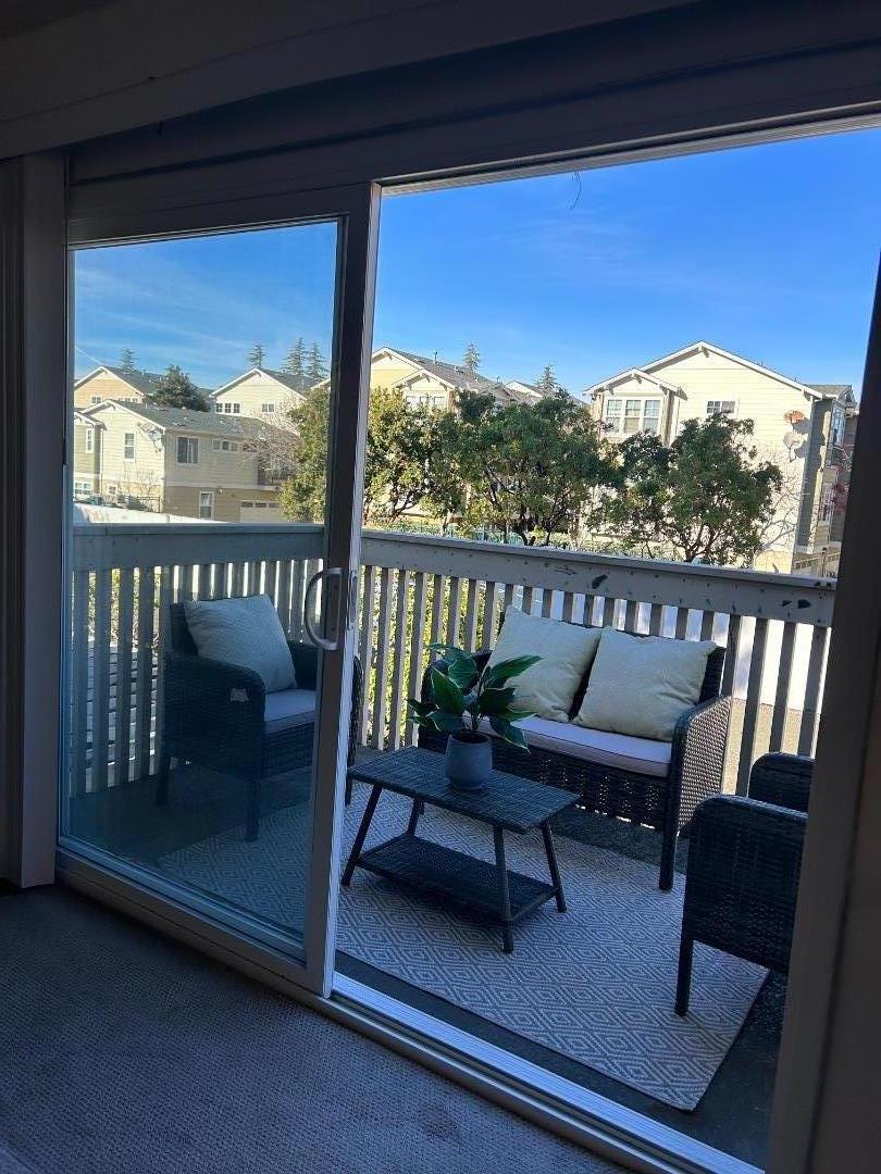 1119 Reed Avenue, Unit C Sunnyvale, CA 94086 - Photo 17 of 20 a view of a balcony with furniture and a porch
