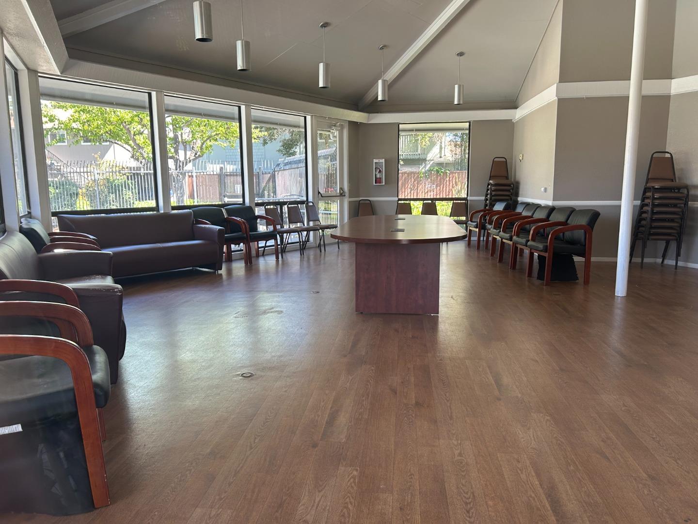 1119 Reed Avenue, Unit C Sunnyvale, CA 94086 - Photo 19 of 20 a livingroom with furniture wooden floor and a large window