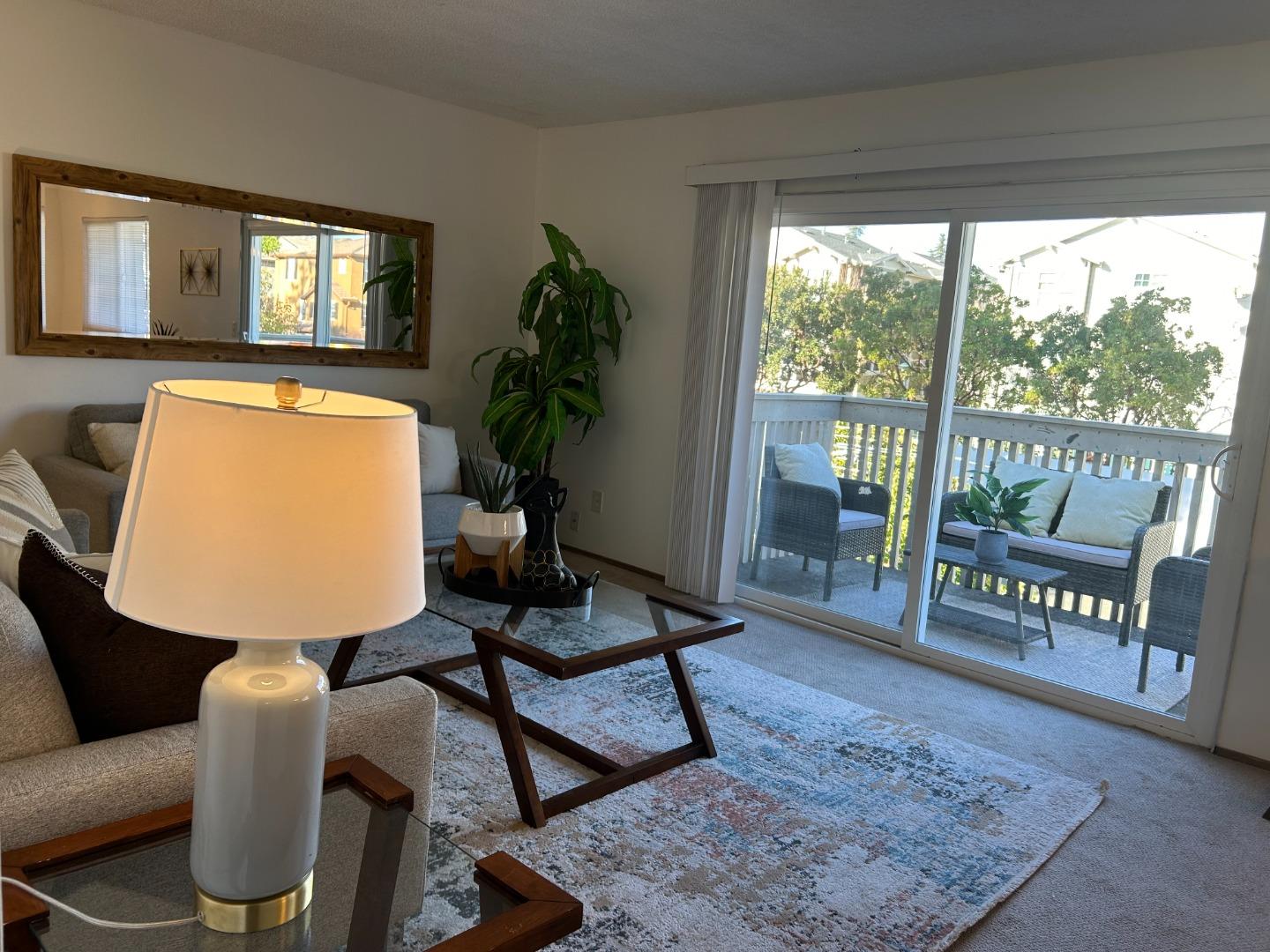 1119 Reed Avenue, Unit C Sunnyvale, CA 94086 - Photo 5 of 20 a living room with furniture and a potted plant
