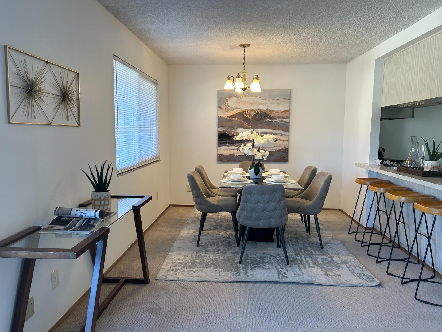 1119 Reed Avenue, Unit C Sunnyvale, CA 94086 - Photo 6 of 20 a view of a dining room with furniture window and wooden floor