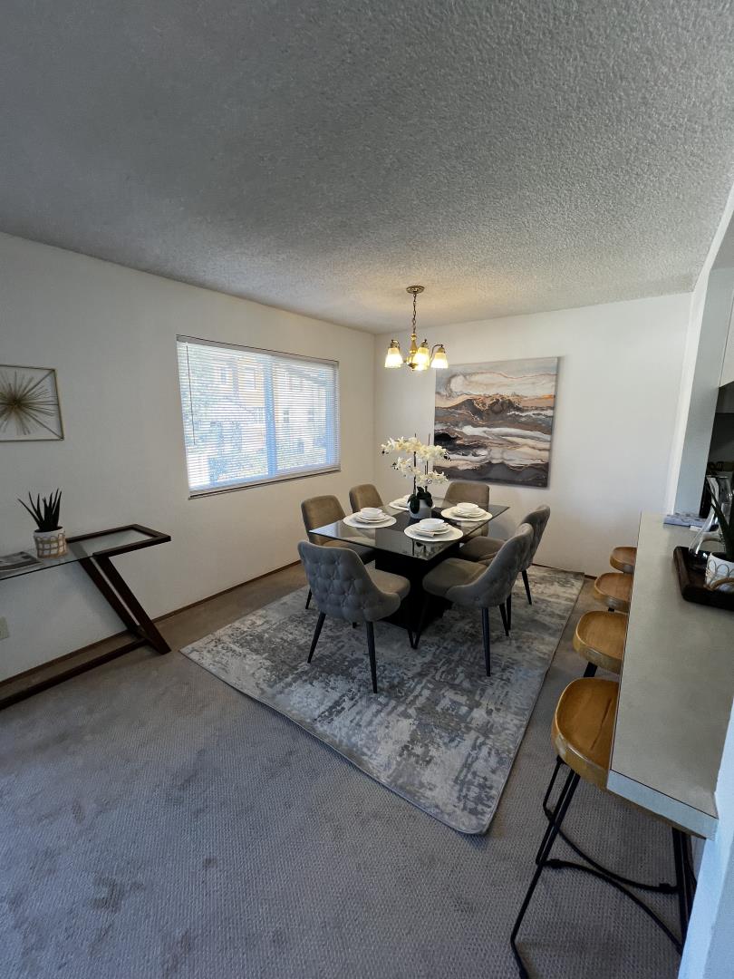 1119 Reed Avenue, Unit C Sunnyvale, CA 94086 - Photo 7 of 20 a living room with furniture a rug and a window
