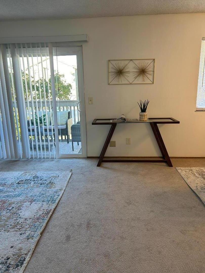 1119 Reed Avenue, Unit C Sunnyvale, CA 94086 - Photo 9 of 20 a view of a livingroom with furniture and window