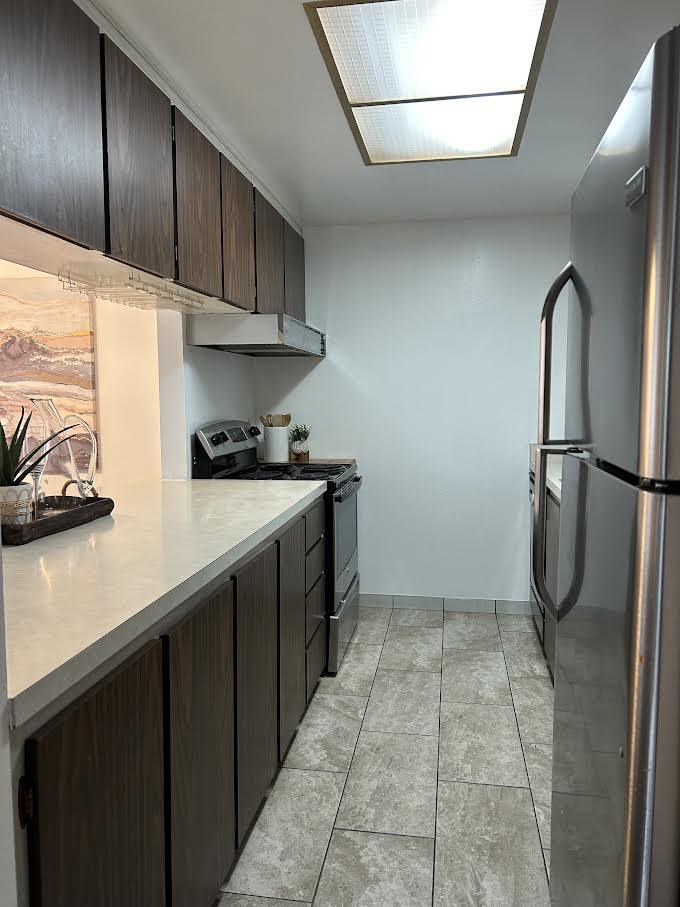 1119 Reed Avenue, Unit C Sunnyvale, CA 94086 - Photo 10 of 20 a kitchen with a sink a refrigerator and cabinets