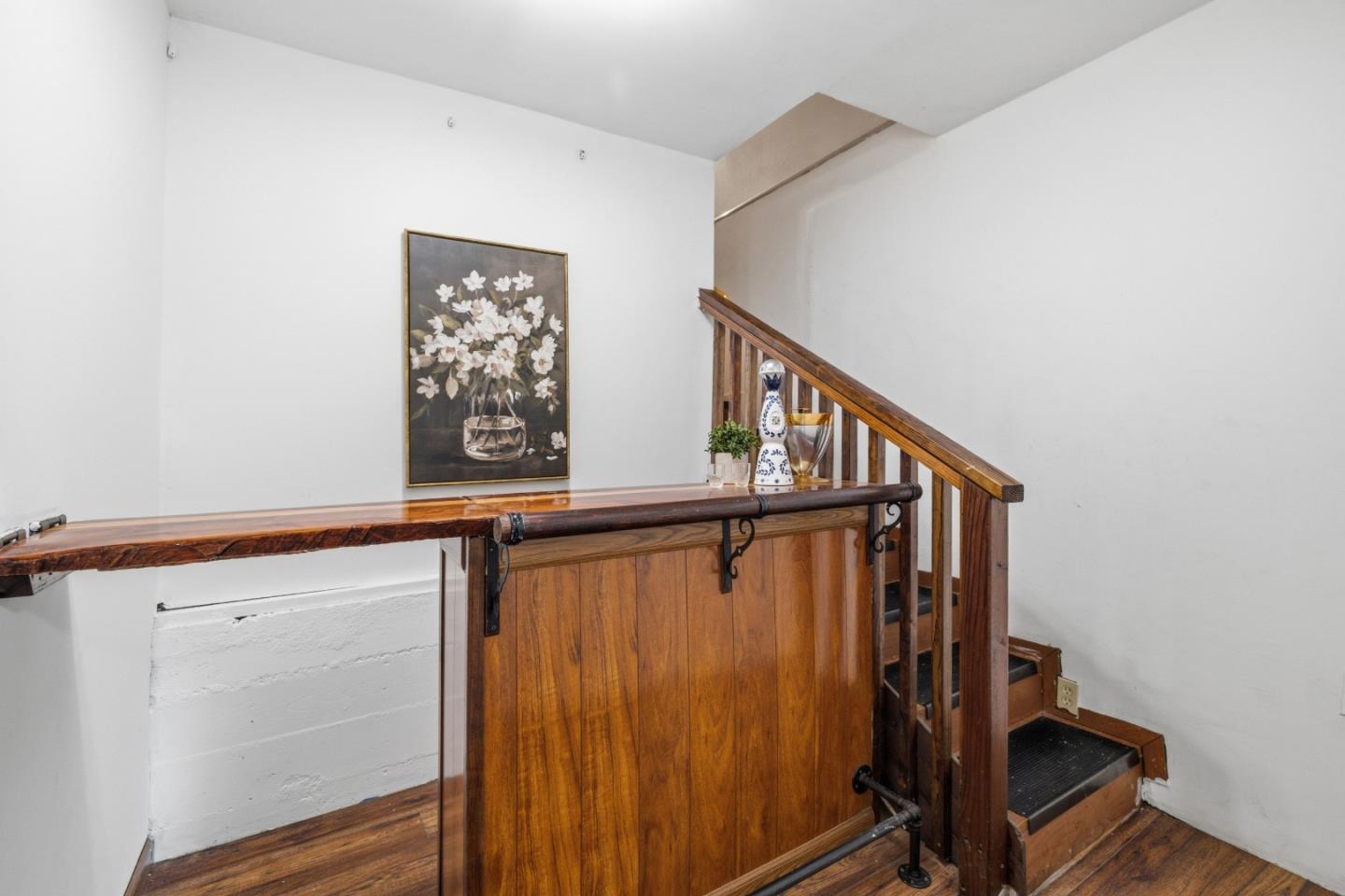 320 Fireside Road Boulder Creek, CA 95006 - Photo 16 of 45 a view of staircase with wooden floor and white walls