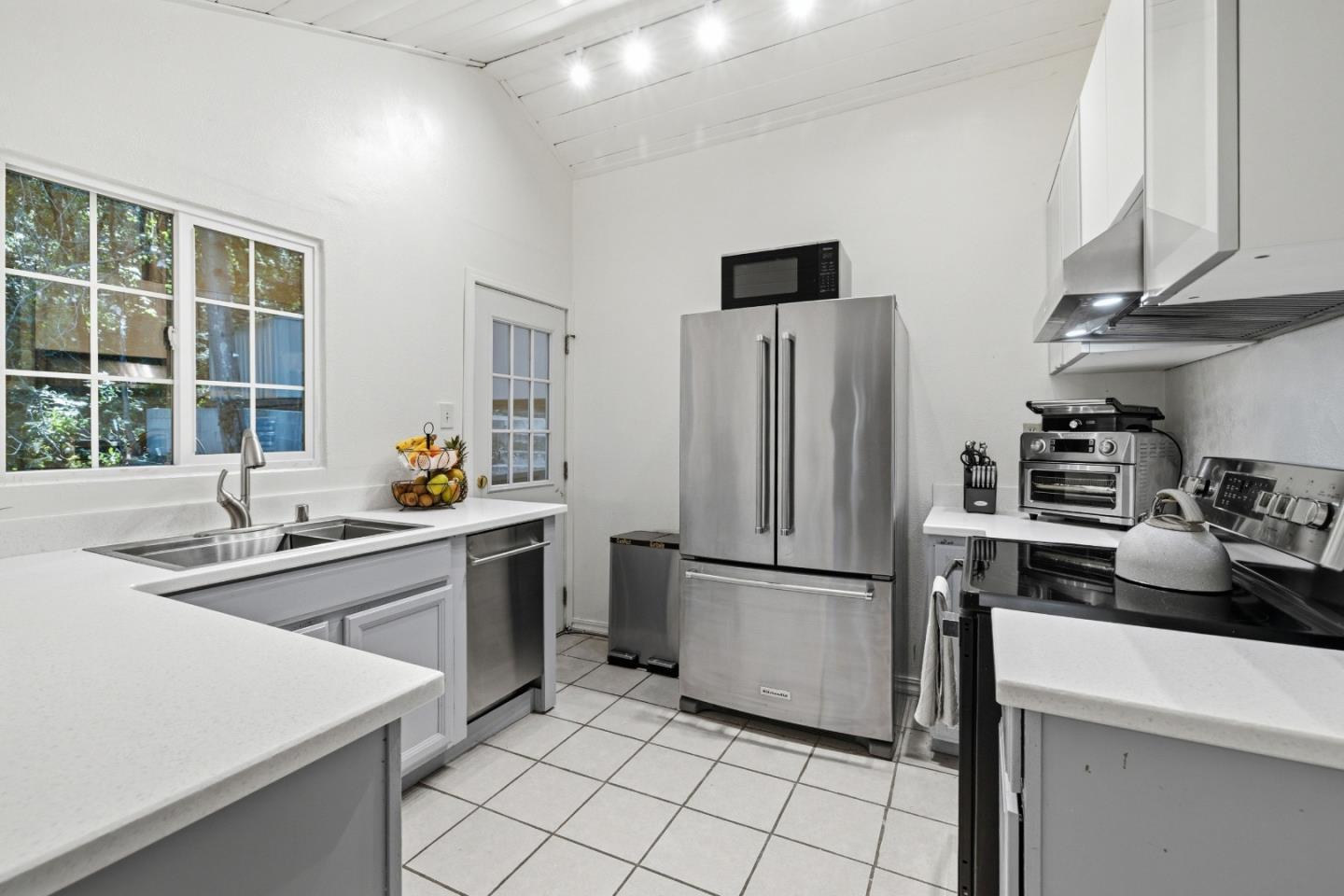 320 Fireside Road Boulder Creek, CA 95006 - Photo 6 of 45 a kitchen with stainless steel appliances a refrigerator sink and stove