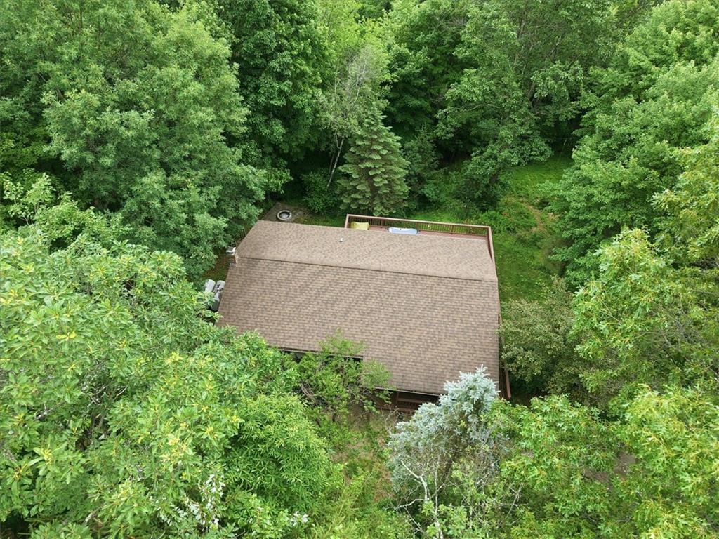 520 Highland Hill Road Jim Thorpe, PA 18235 - Photo 71 of 83 Nestled amidst verdant trees, this secluded residence features a private deck perfect for peaceful outdoor living.