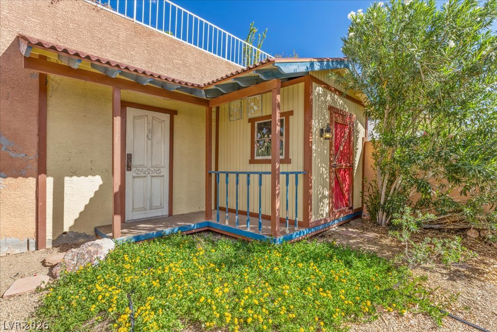 120 Ringlore Road Henderson, NV 89015 - Photo 32 of 58 Charming detached outbuildings provide versatile utility space nestled within the natural desert landscaping.