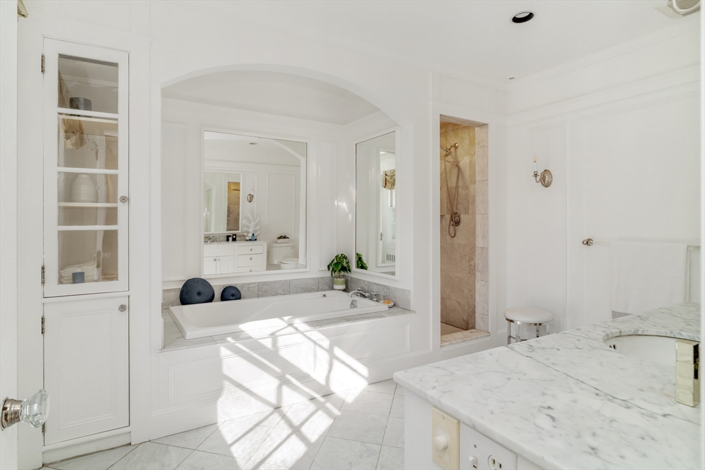 10 Rangeley Road Winchester, MA 01890 - Photo 22 of 42 a spacious bathroom with a tub sink and mirror