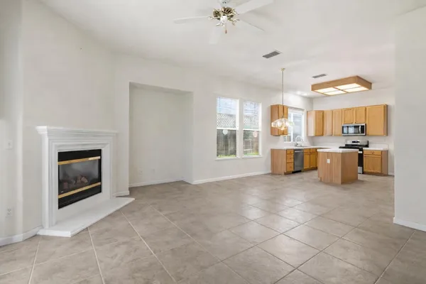 a kitchen with a refrigerator and a sink