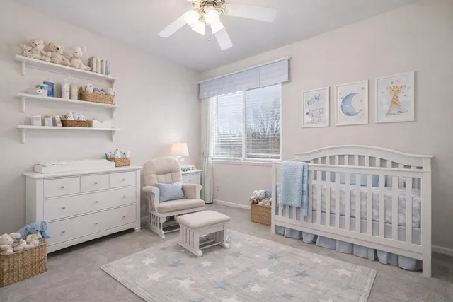 a bathroom with double vanity and a mirror