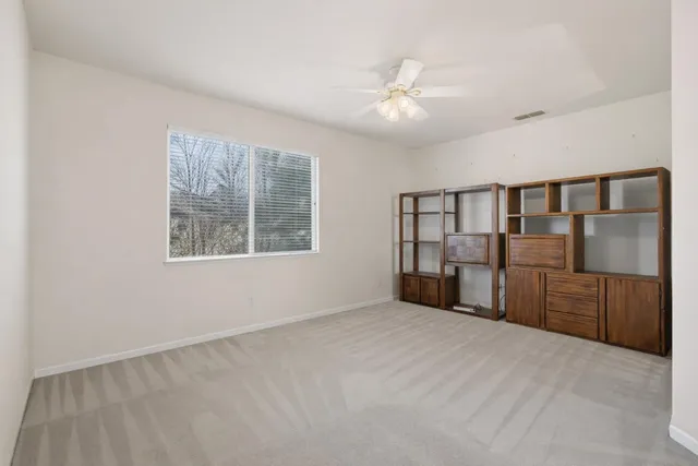a view of a backyard with sitting area