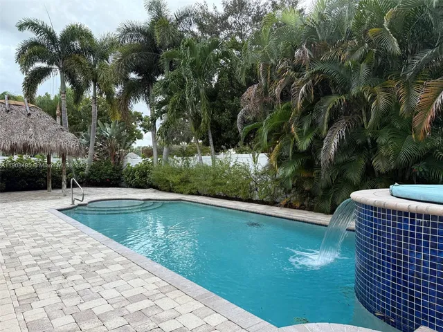 a view of a swimming pool with a patio